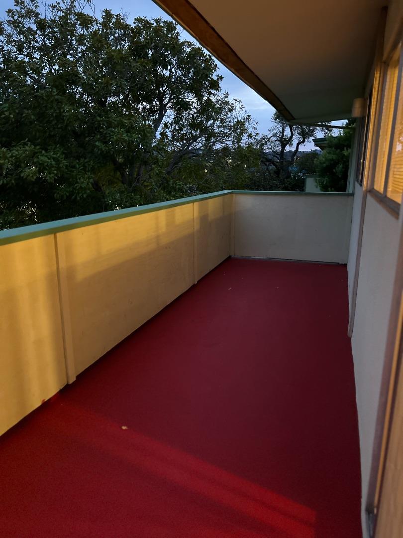 1506 Shoreview Avenue, Unit 6 San Mateo, CA 94401 - Photo 12 of 13 a view of swimming pool with seating space and trees in the background
