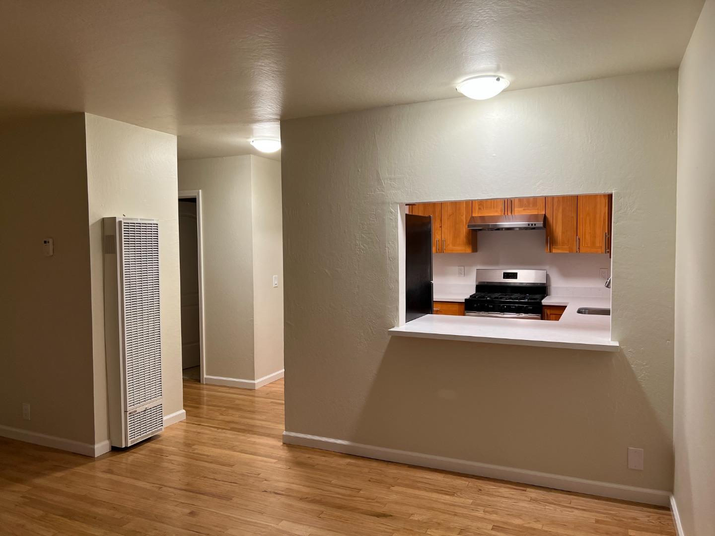 1506 Shoreview Avenue, Unit 6 San Mateo, CA 94401 - Photo 4 of 13 a view of a living room and bathroom with a sink
