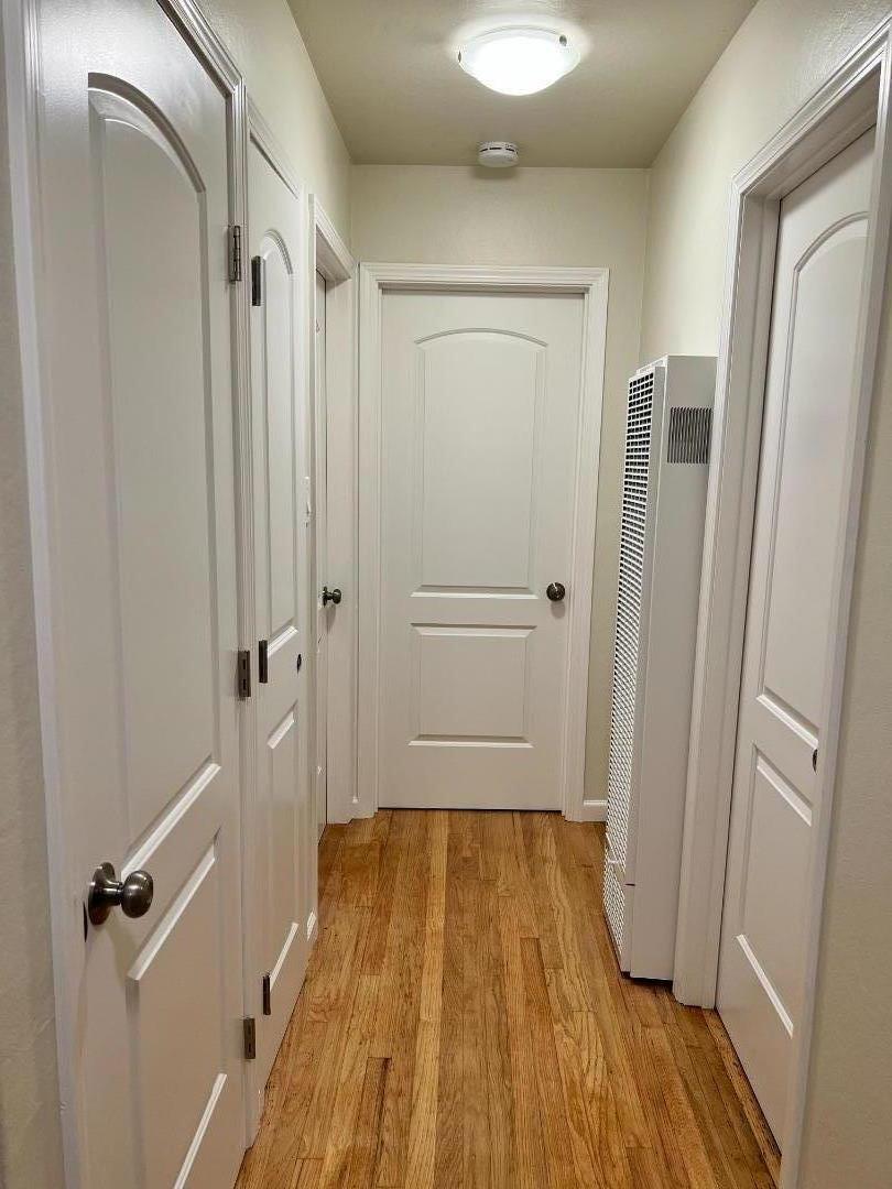 1506 Shoreview Avenue, Unit 6 San Mateo, CA 94401 - Photo 9 of 13 a view of a hallway with wooden floor and closet area
