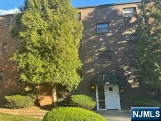 a view of a street with flower plants