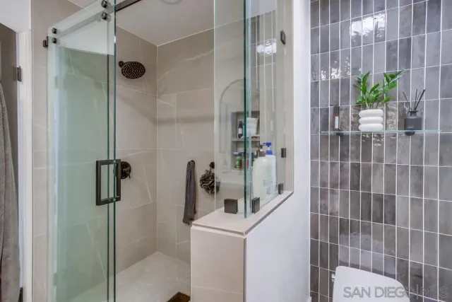 a living room with furniture a window and a flat screen tv