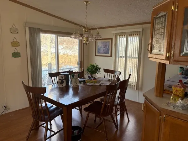 a view of a dining room with furniture window and outside view