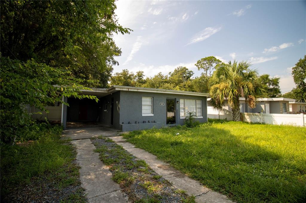 809 Maley Street Daytona Beach, FL 32114 - Photo 1 of 15 a view of a house with backyard and garden