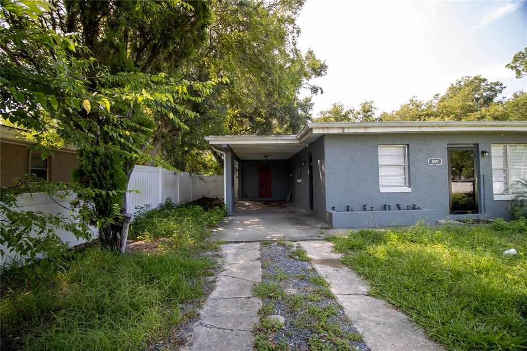 809 Maley Street Daytona Beach, FL 32114 - Photo 2 of 15 a front view of a house with a yard