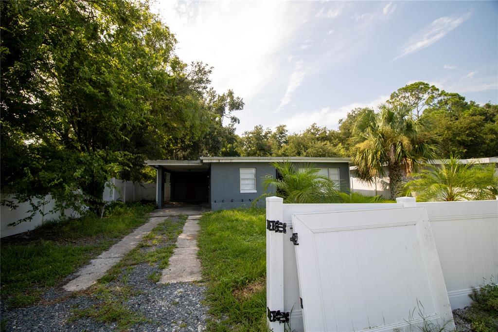 809 Maley Street Daytona Beach, FL 32114 - Photo 4 of 15 a house view with a garden space