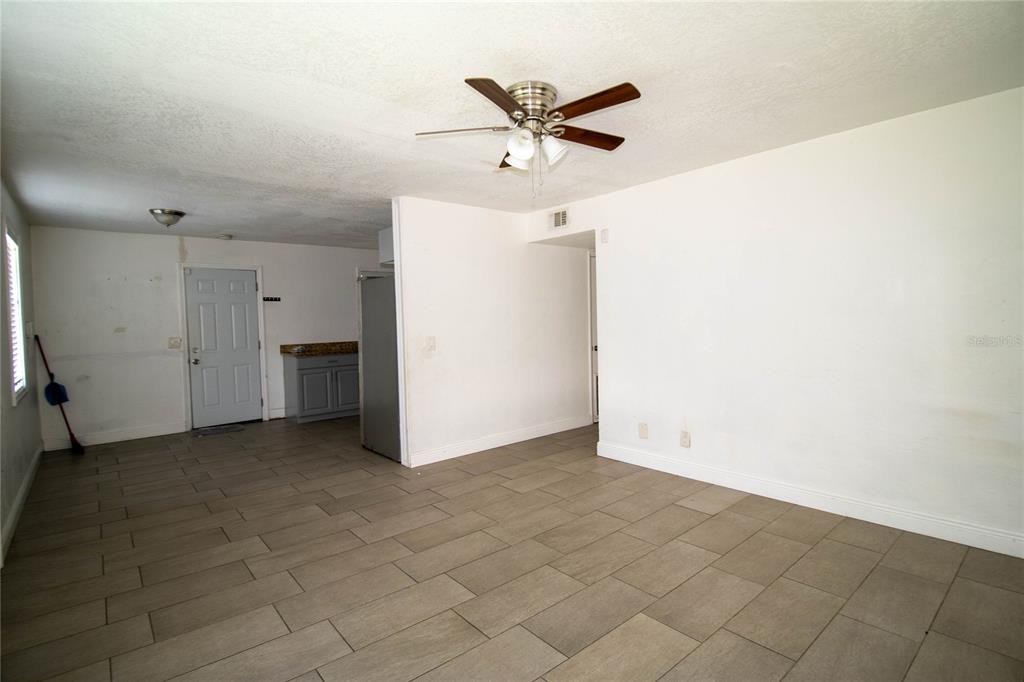 809 Maley Street Daytona Beach, FL 32114 - Photo 6 of 15 an empty room with closet and ceiling fan