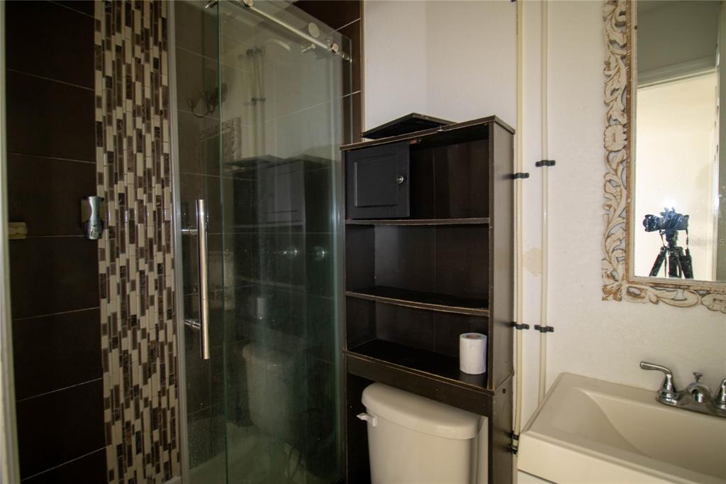 809 Maley Street Daytona Beach, FL 32114 - Photo 9 of 15 a bathroom with a shower and a sink