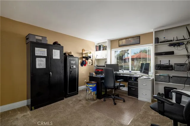 a bedroom with a bed chair and window
