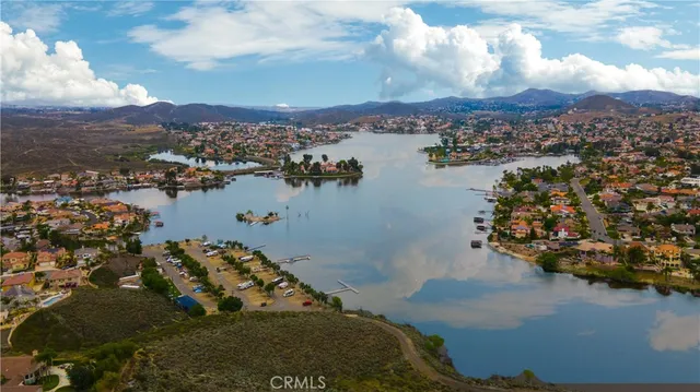 an aerial view of ocean and residential houses