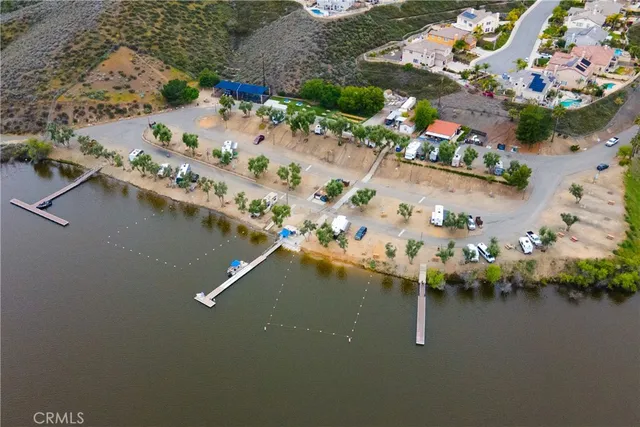 an aerial view of a house with a lake view
