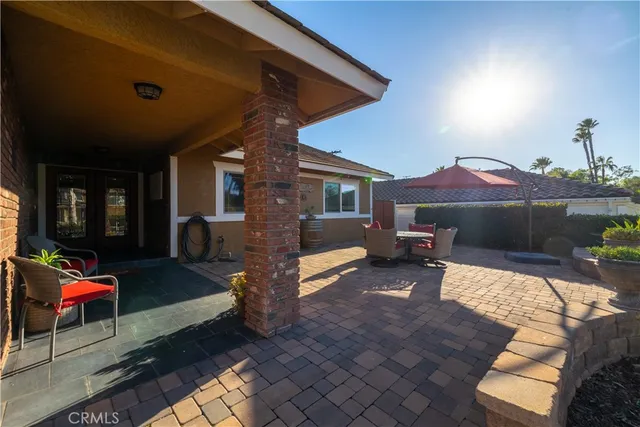 a outdoor space with patio lots of furniture and a fireplace