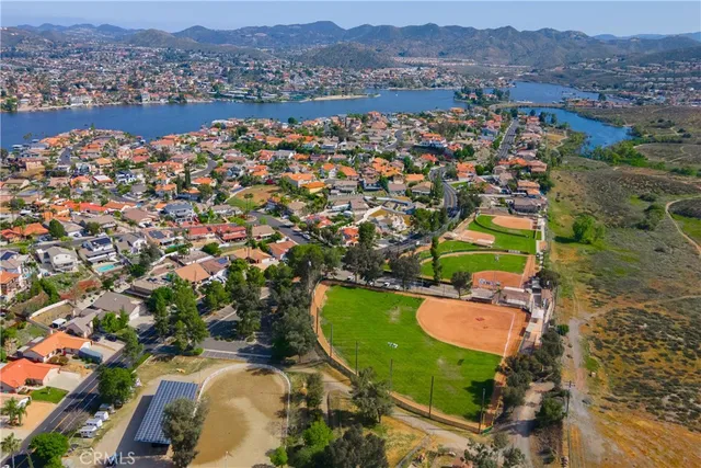 an aerial view of a house with a garden and swimming pool