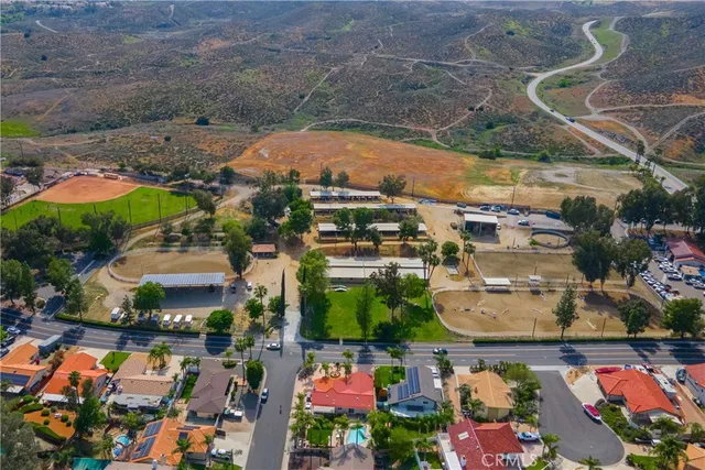 an aerial view of residential houses with outdoor space
