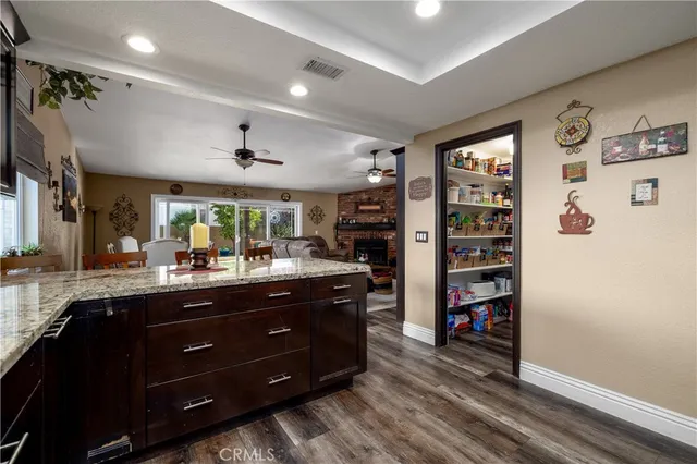 a living room with fireplace furniture and a flat screen tv
