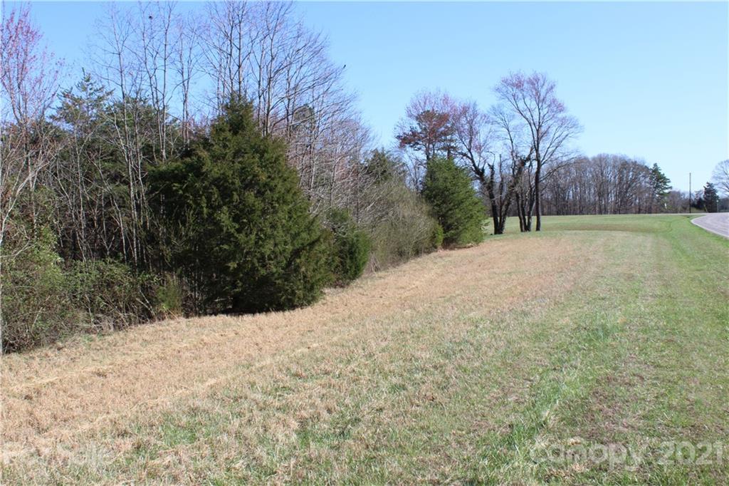 40 Huckleberry Ridge Road Hiddenite, NC 28636 - Photo 22 of 48 a view of a yard covered with snow in front of house