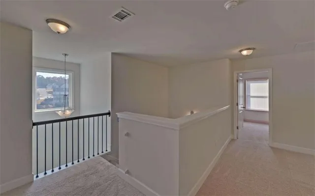 a view of a hallway with windows