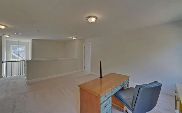 a view of a room with kitchen island stainless steel appliances wooden floor and a window