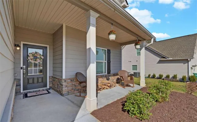 a view of a patio with table and chairs and potted plants