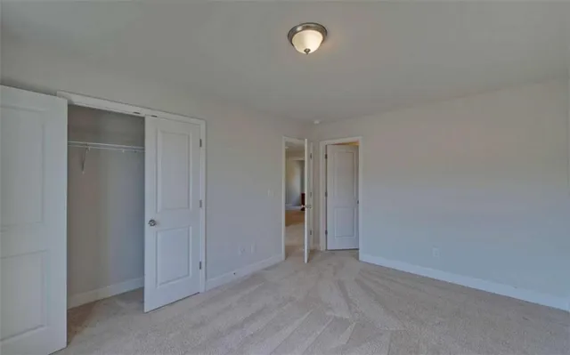 a view of an empty room and a window