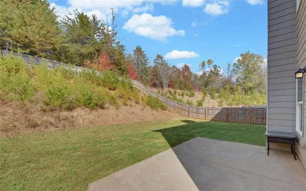a view of a backyard of the house