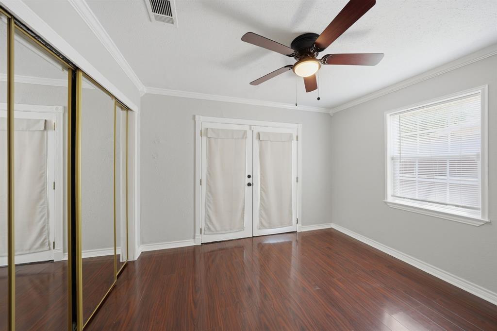 1108 Billie Ruth Lane Hurst, TX 76053 - Photo 18 of 27 Room featuring wood-finish flooring, a ceiling fan with integrated lighting, and crown molding