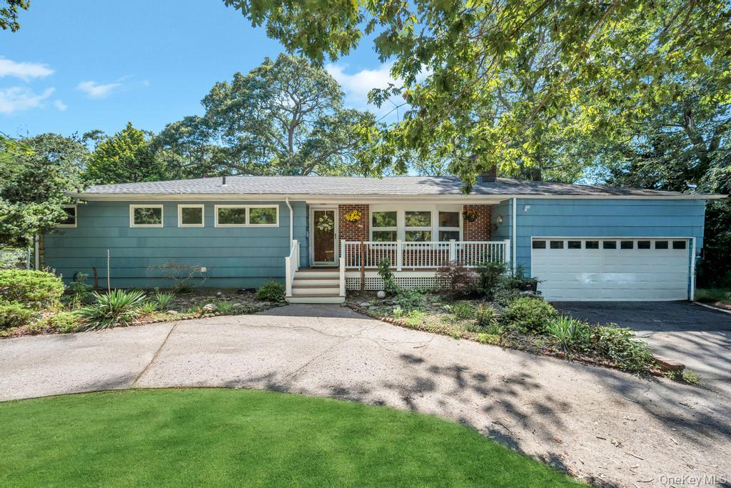 12 Inwood Road Center Moriches, NY 11934 - Photo 1 of 1 Ranch-style house with driveway, an attached garage, covered porch, and roof with shingles