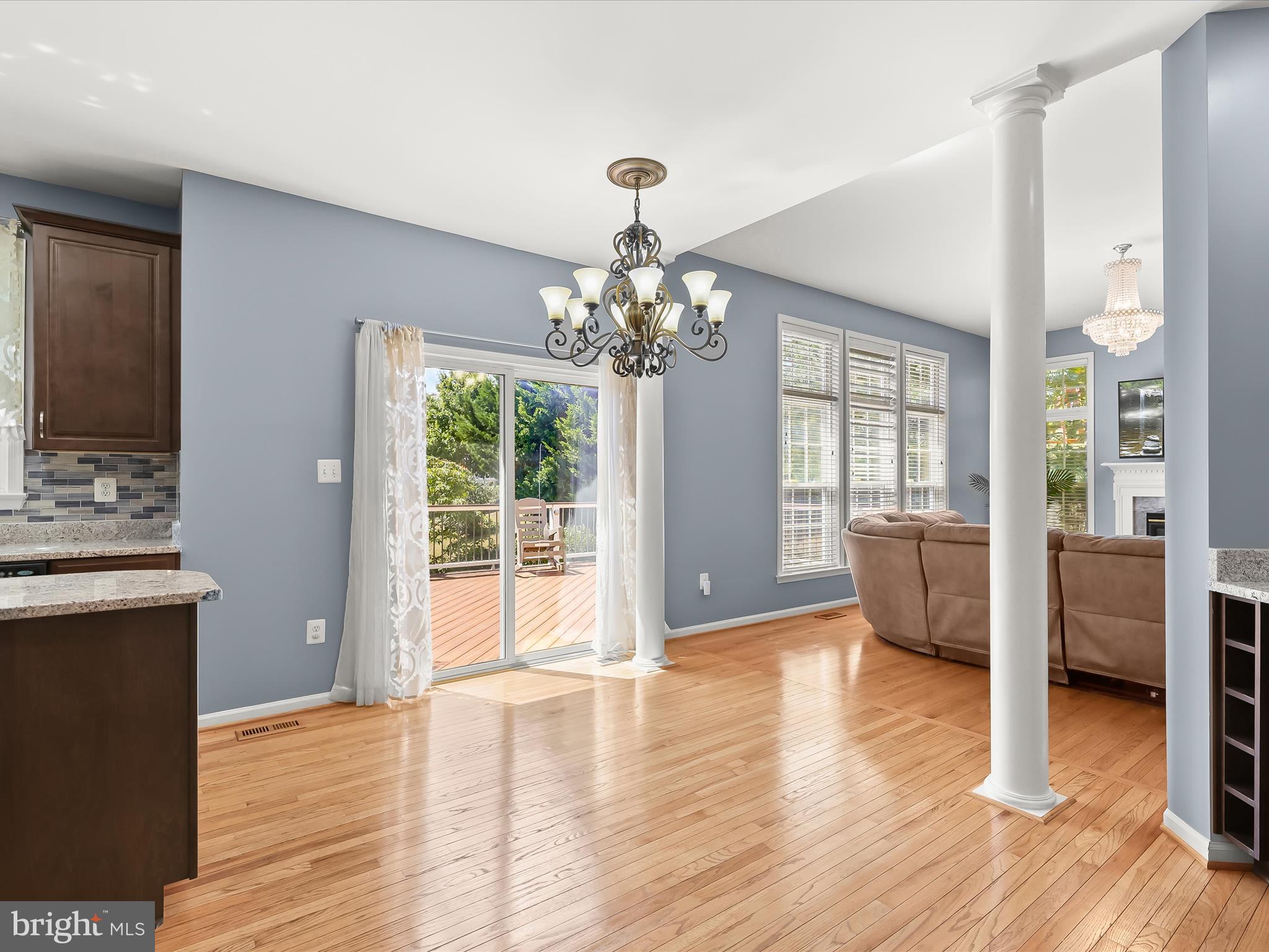 5816 Rockburn Woods Way Elkridge, MD 21075 - Photo 17 of 64 a view of a room with wooden floor and windows