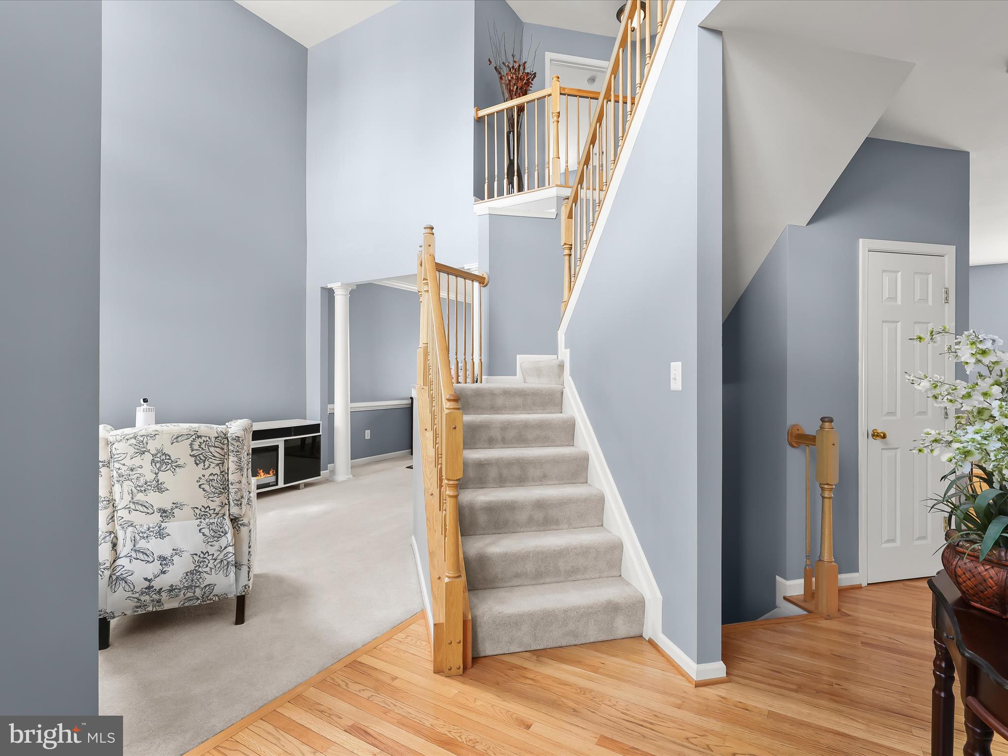 5816 Rockburn Woods Way Elkridge, MD 21075 - Photo 3 of 64 a view of entryway and hall with wooden floor