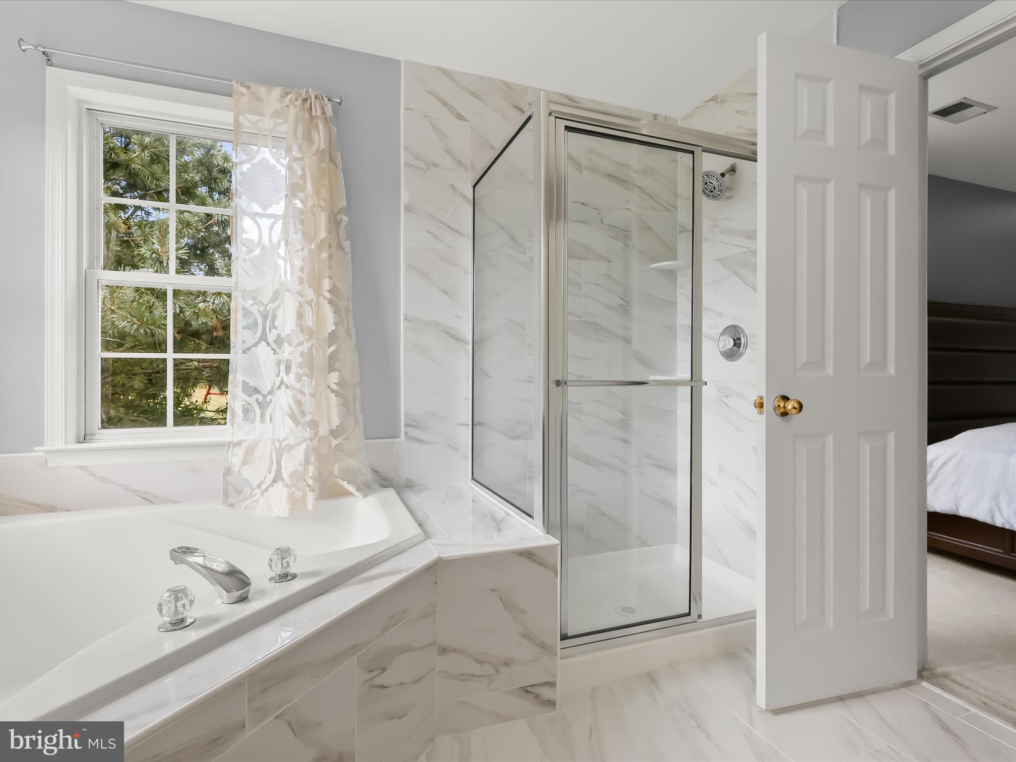 5816 Rockburn Woods Way Elkridge, MD 21075 - Photo 32 of 64 a bathroom with a granite countertop bathtub and shower