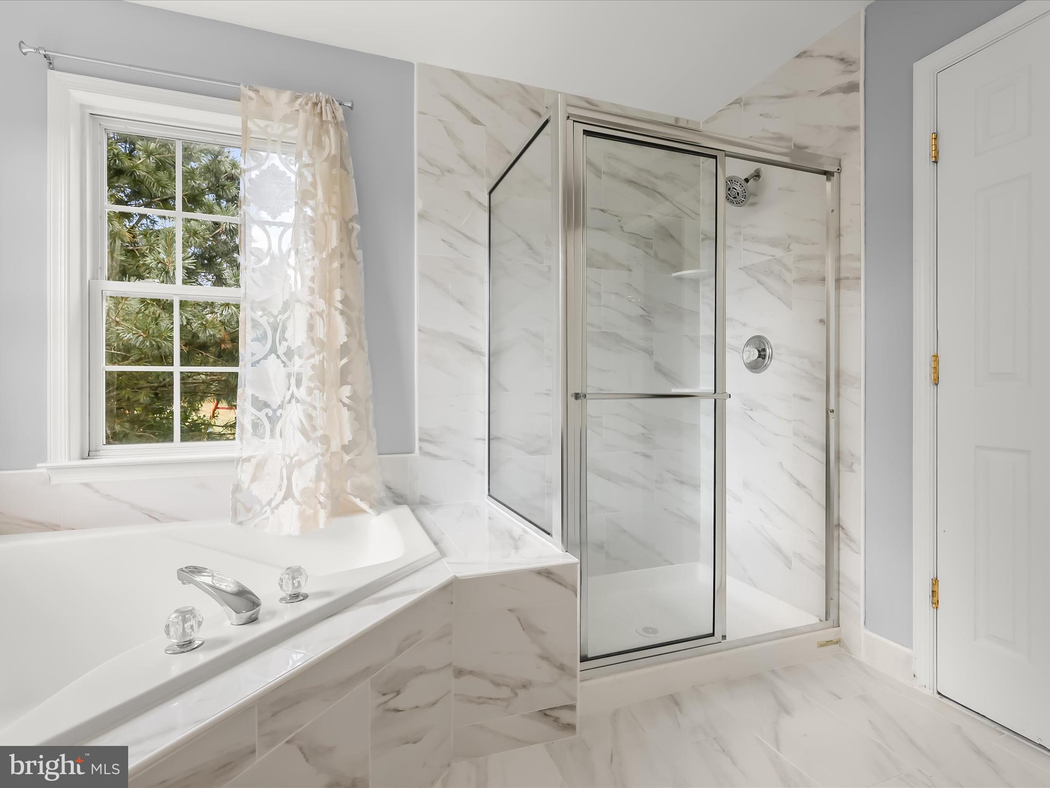 5816 Rockburn Woods Way Elkridge, MD 21075 - Photo 33 of 64 a bathroom with a granite countertop bathtub and shower