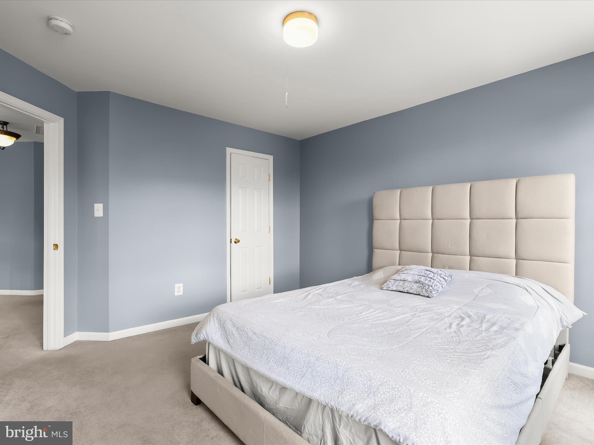 5816 Rockburn Woods Way Elkridge, MD 21075 - Photo 37 of 64 a bedroom with a bed and a large window