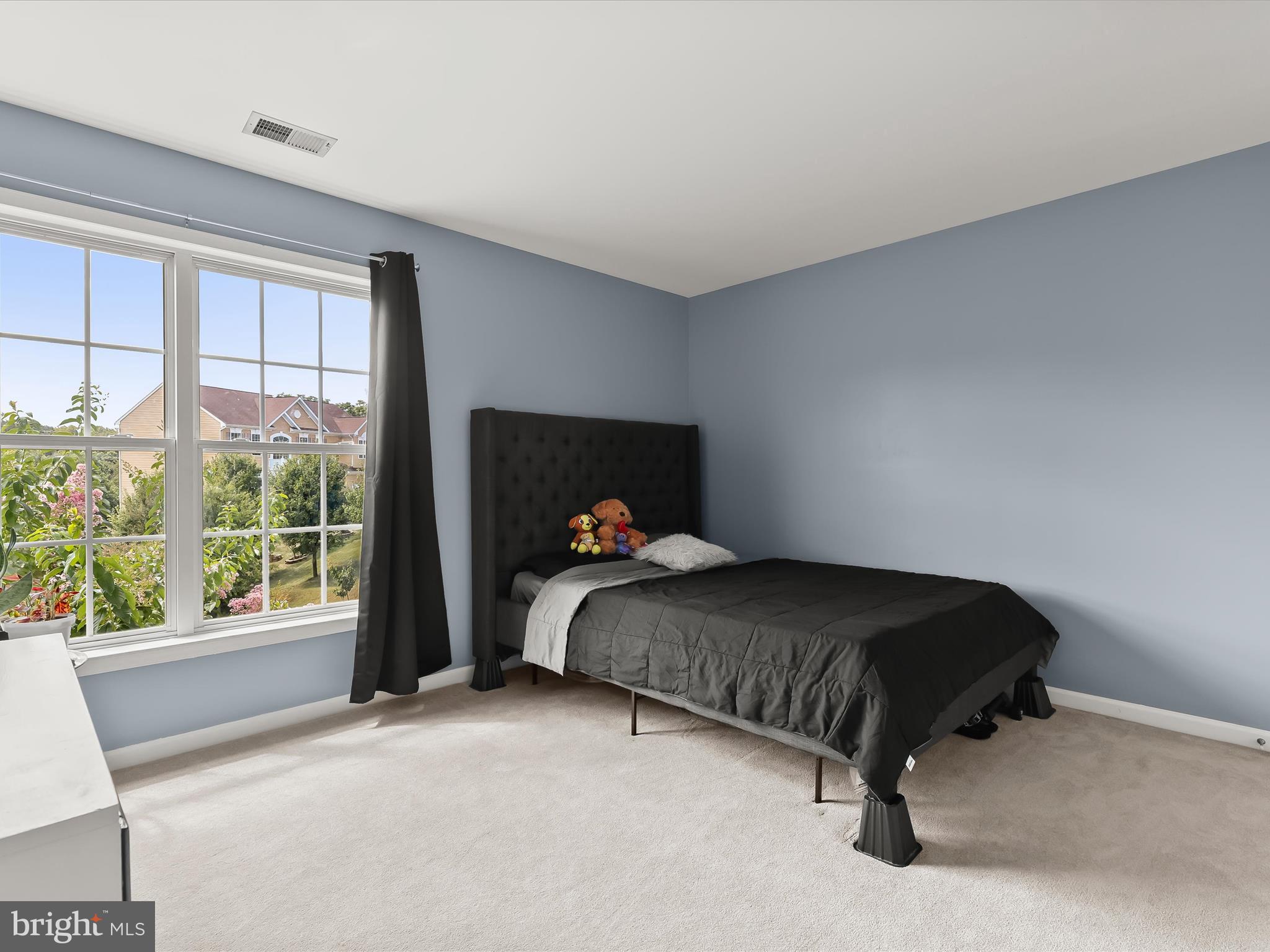 5816 Rockburn Woods Way Elkridge, MD 21075 - Photo 38 of 64 a bedroom with a bed and window