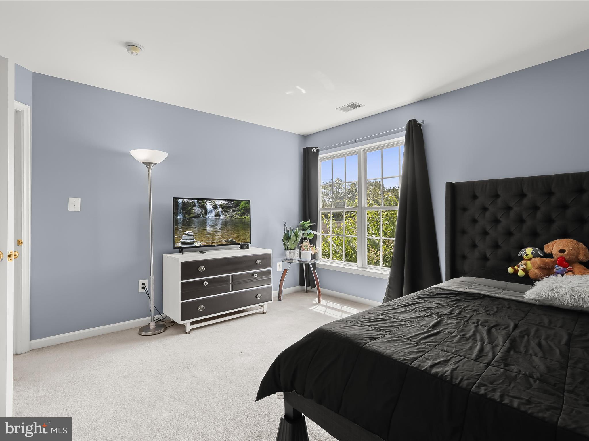 5816 Rockburn Woods Way Elkridge, MD 21075 - Photo 40 of 64 a bedroom with a bed and a window