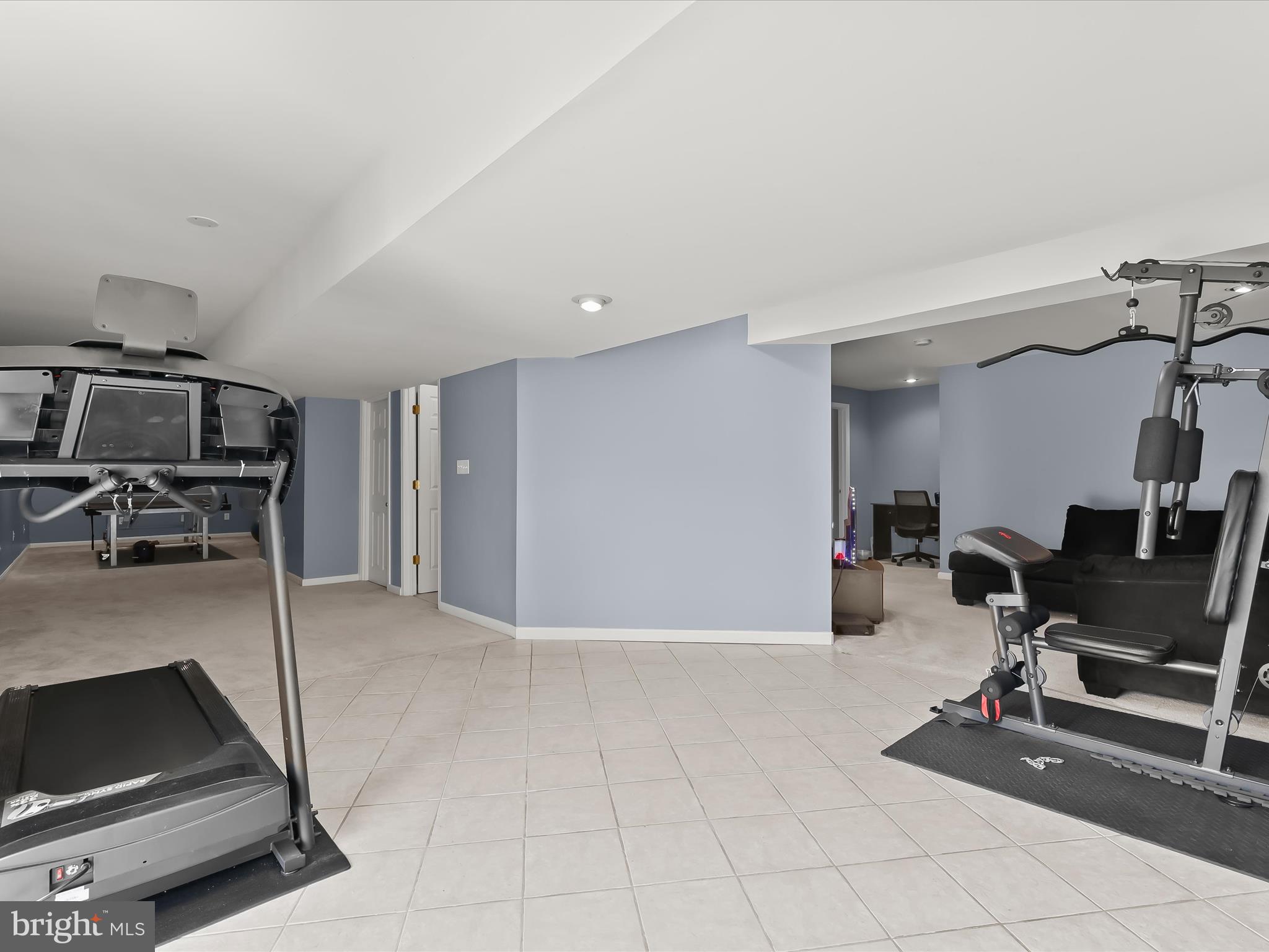 5816 Rockburn Woods Way Elkridge, MD 21075 - Photo 50 of 64 a view of a workspace with furniture and gym equipment