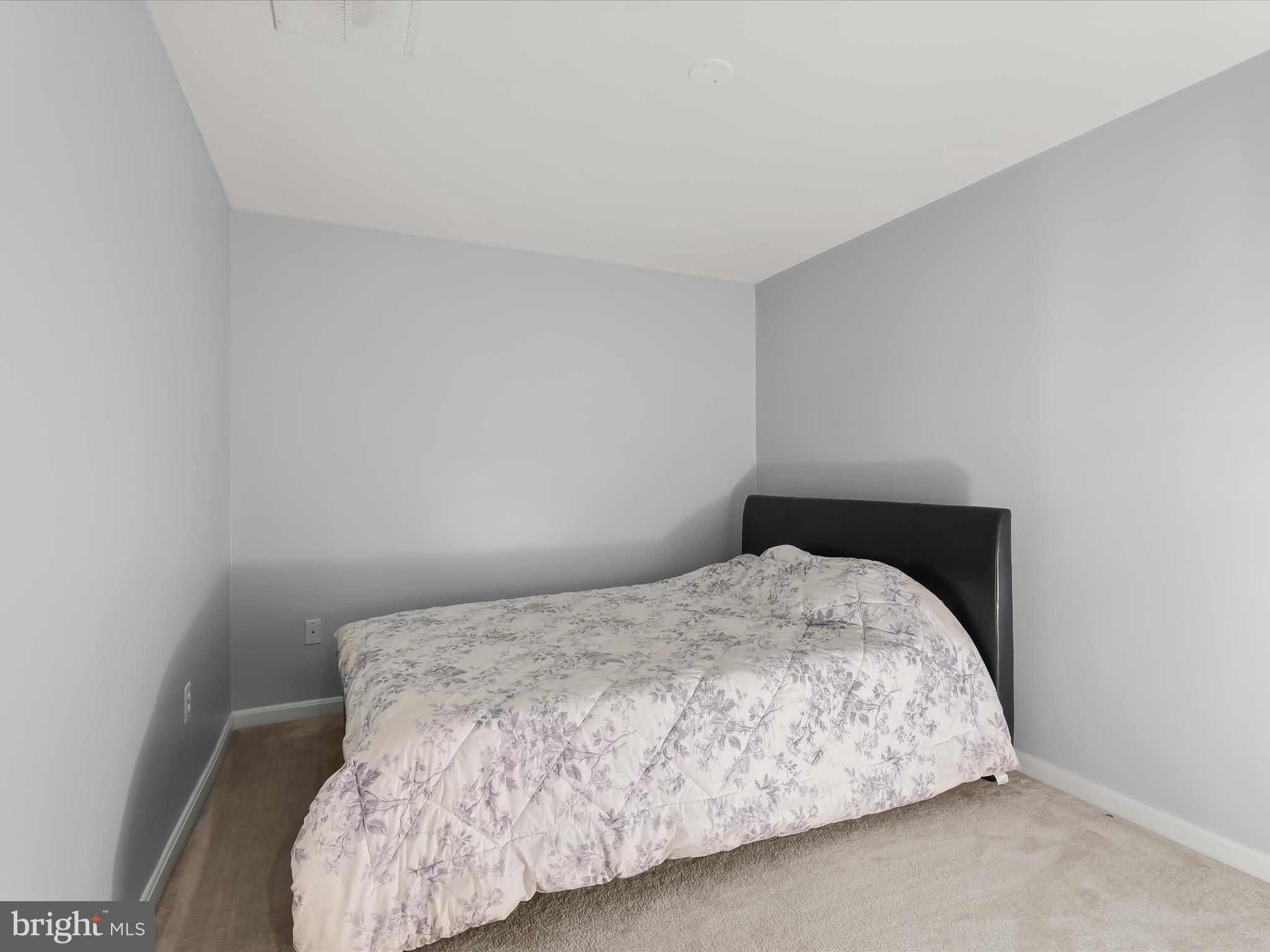 5816 Rockburn Woods Way Elkridge, MD 21075 - Photo 52 of 64 a bedroom with a bed and a window