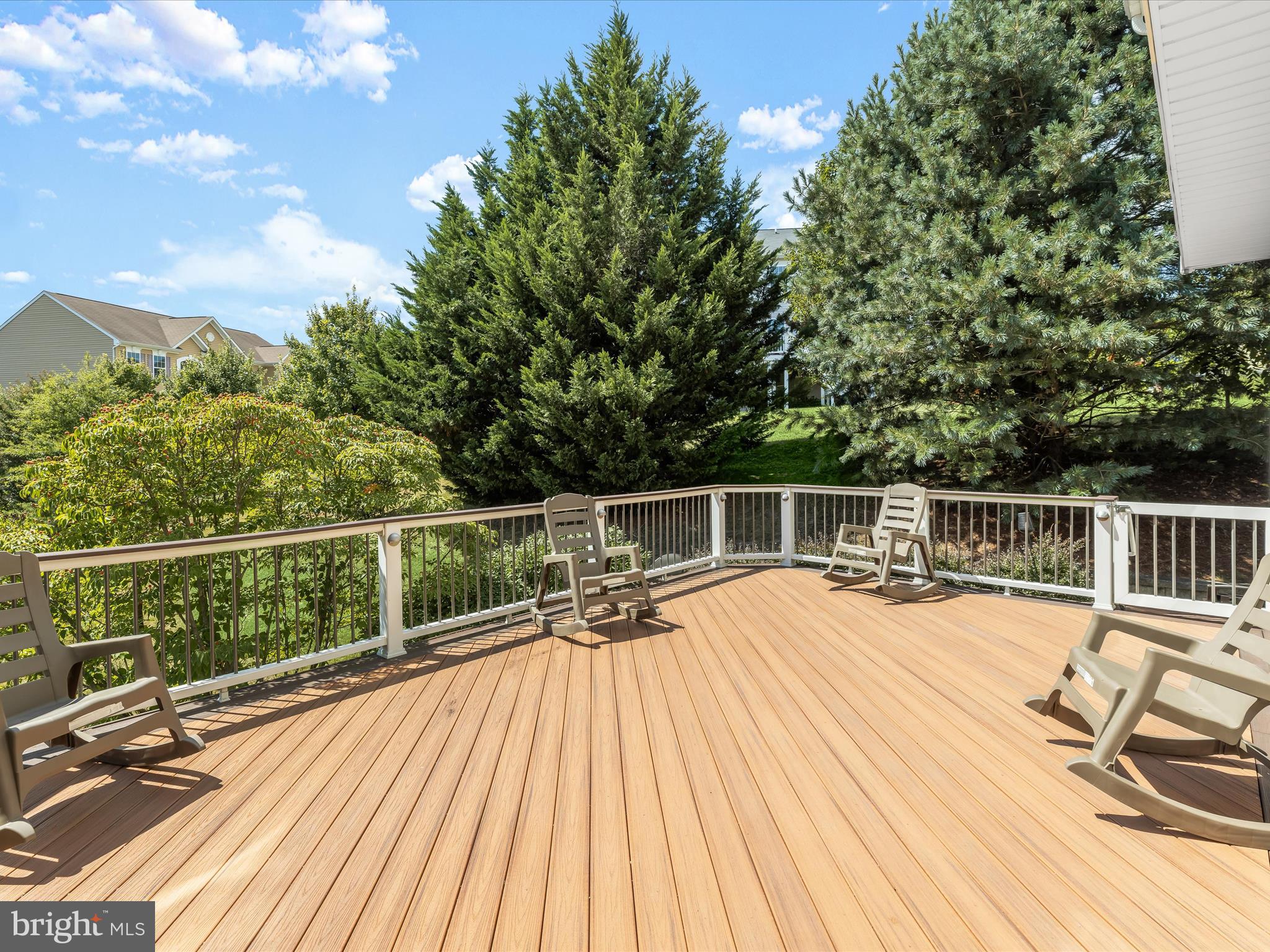 5816 Rockburn Woods Way Elkridge, MD 21075 - Photo 54 of 64 a view of balcony with two chairs and wooden floor
