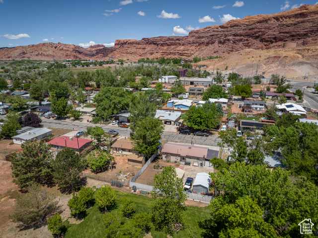 527 Palisade Drive Moab, UT 84532 - Photo 42 of 51 Aerial view of property and surrounding area with a mountainous background