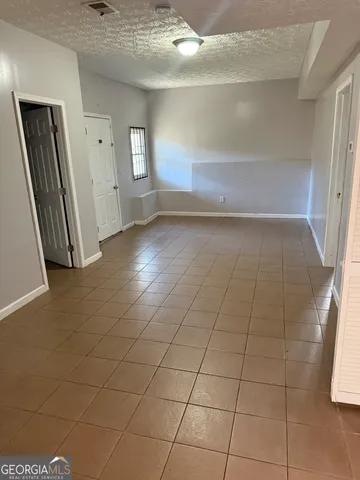 en empty room with windows