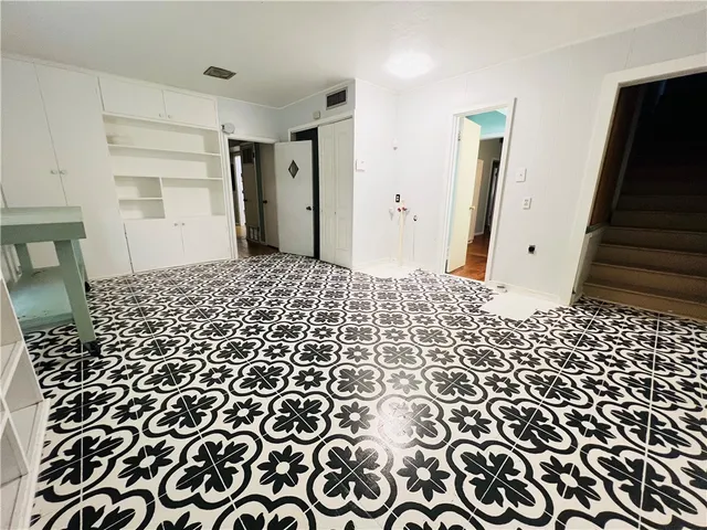 a large room with a black white checkered floor
