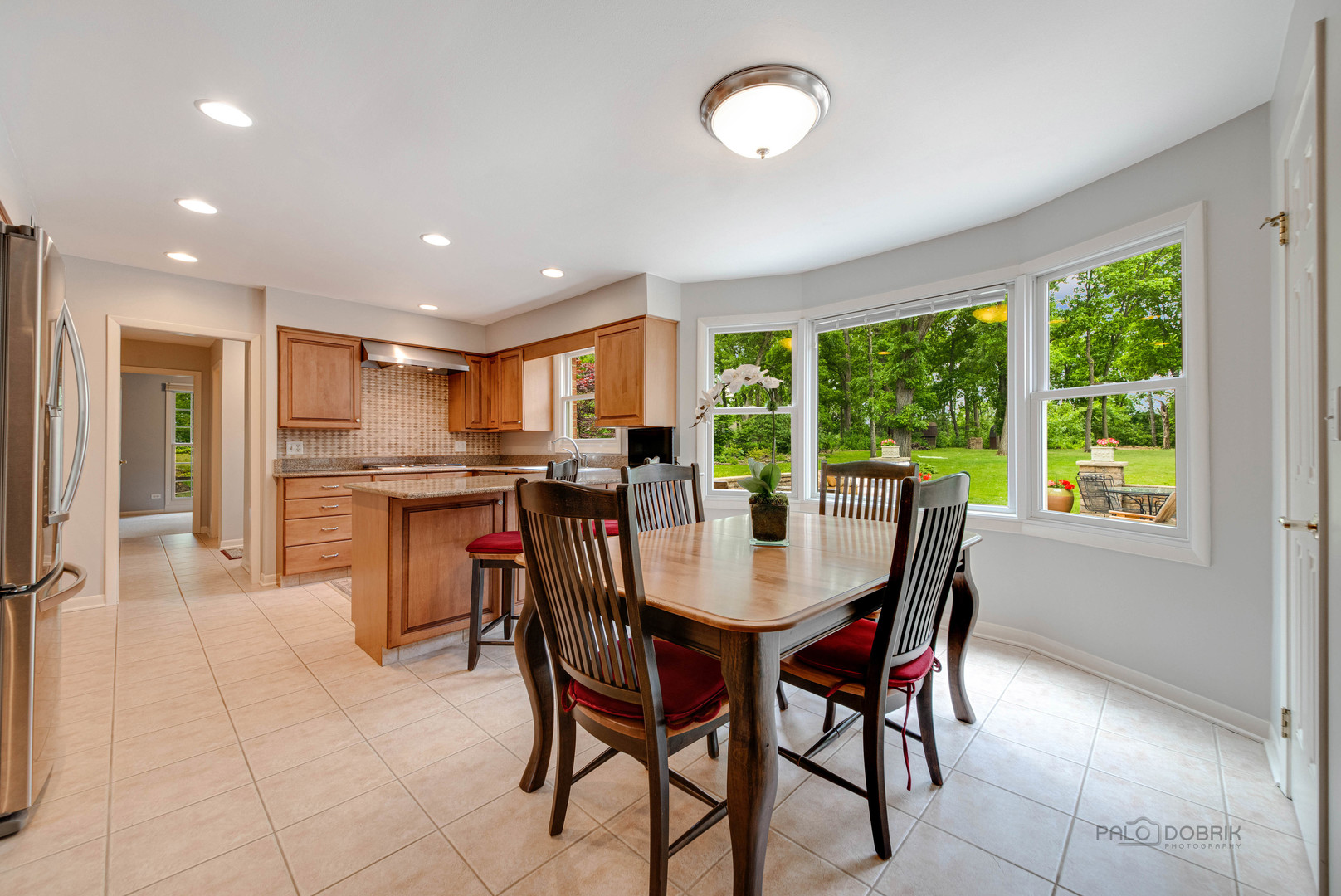 80 North Ridge Road Lake Forest, IL 60045 - Photo 12 of 36 a view of a dining room with furniture and a large window