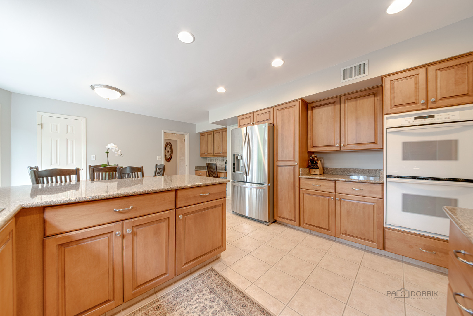 80 North Ridge Road Lake Forest, IL 60045 - Photo 13 of 36 a kitchen with granite countertop cabinets and stainless steel appliances