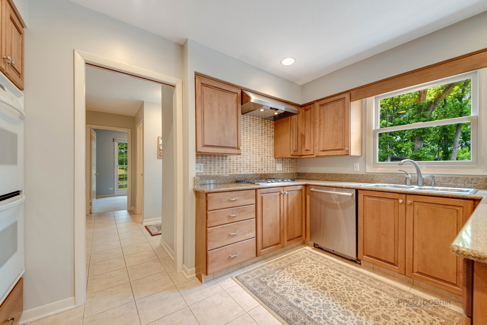 80 North Ridge Road Lake Forest, IL 60045 - Photo 14 of 36 a kitchen with stainless steel appliances granite countertop a refrigerator and a sink