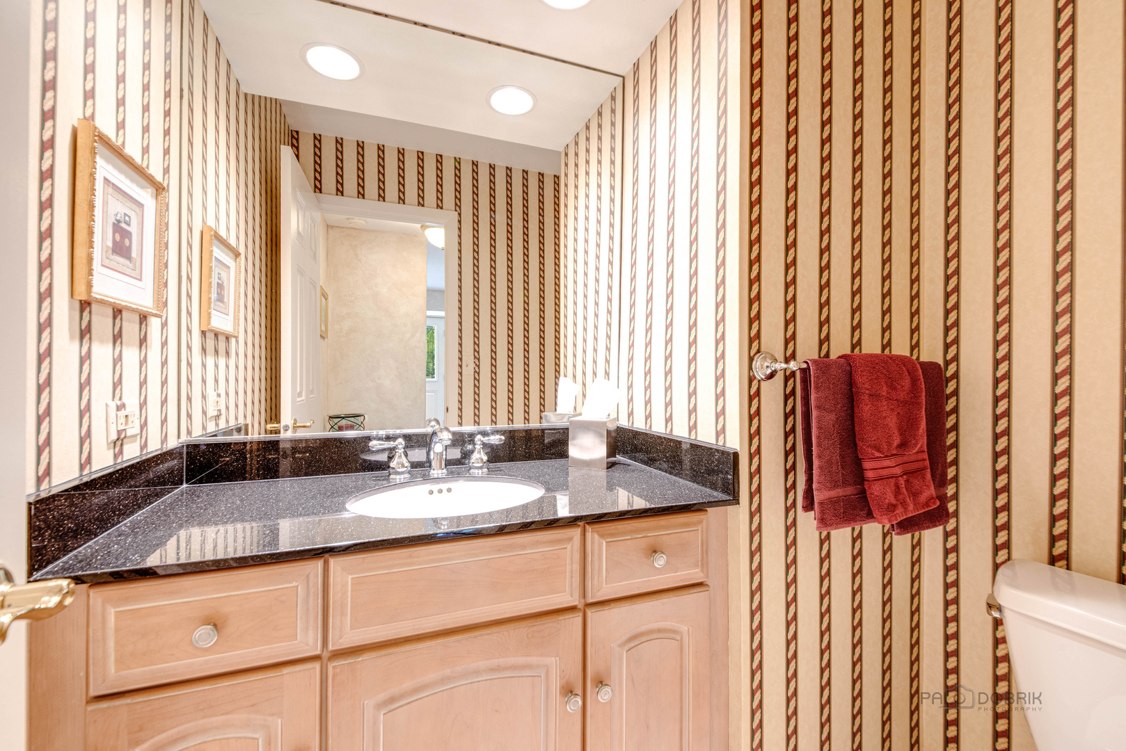 80 North Ridge Road Lake Forest, IL 60045 - Photo 18 of 36 a bathroom with a granite countertop sink and a large mirror