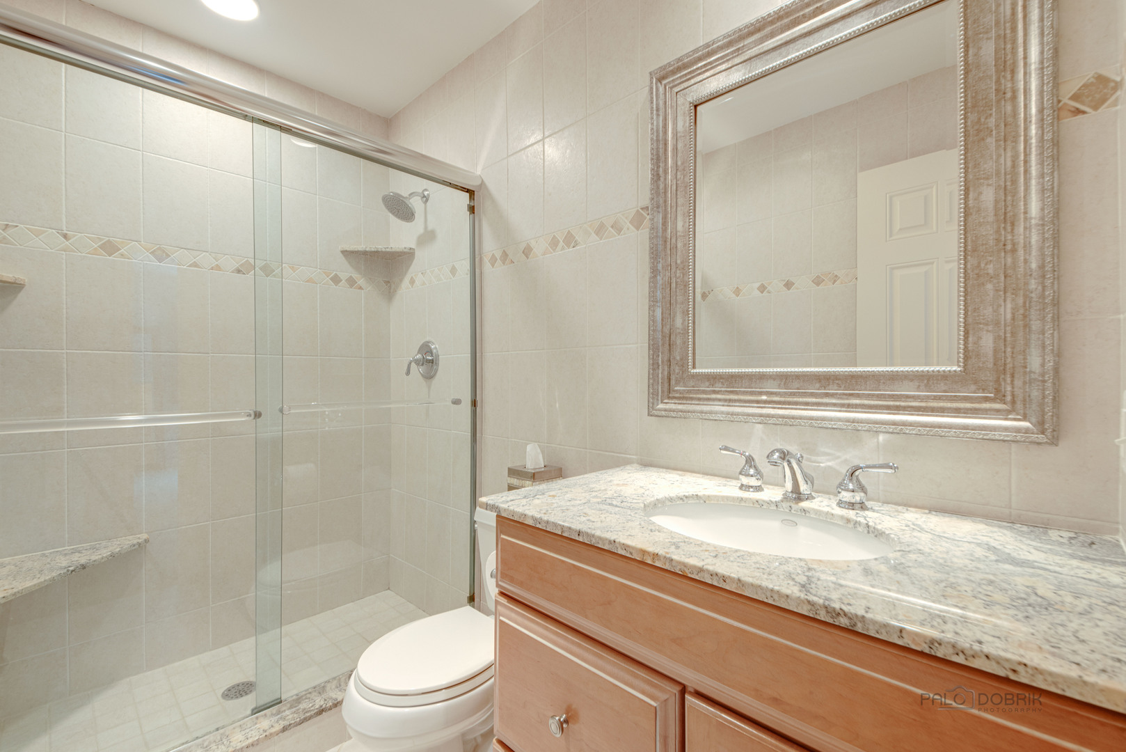 80 North Ridge Road Lake Forest, IL 60045 - Photo 23 of 36 a bathroom with a granite countertop sink a toilet and shower
