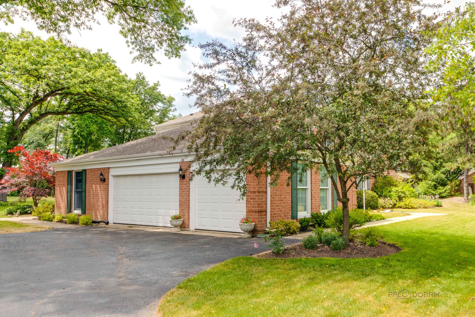 80 North Ridge Road Lake Forest, IL 60045 - Photo 32 of 36 a front view of a house with a yard garage and outdoor seating