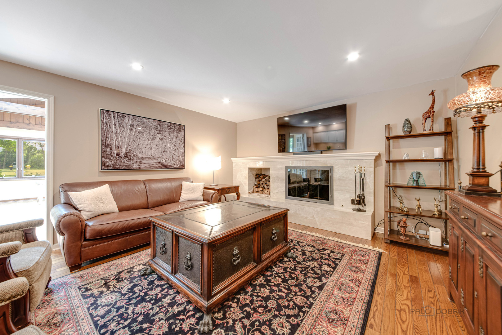 80 North Ridge Road Lake Forest, IL 60045 - Photo 6 of 36 a living room with furniture and a flat screen tv