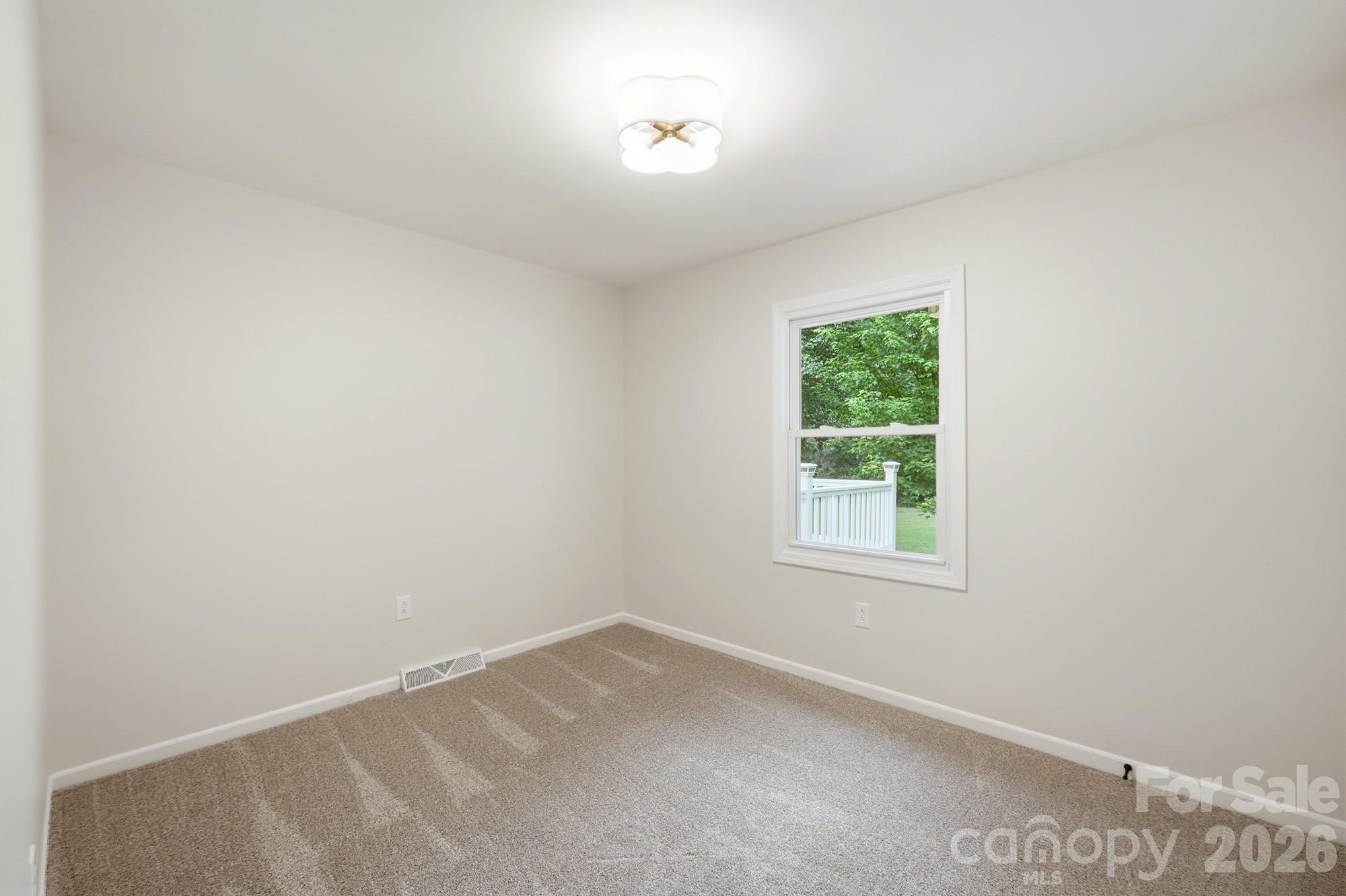 1235 Winecoff School Road Concord, NC 28027 - Photo 19 of 27 an empty room with a window