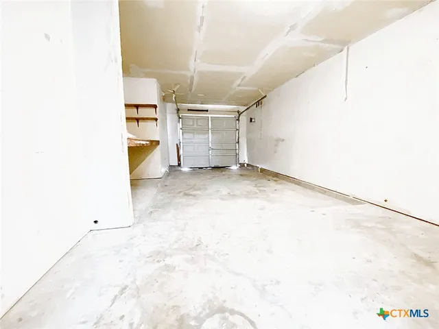 a view of a storage & utility room with a sink