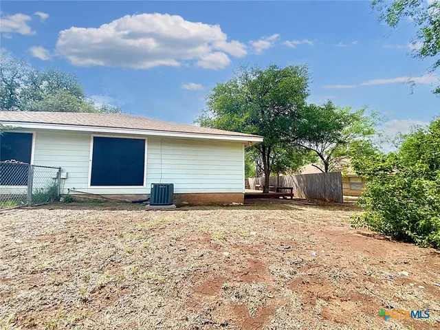 a view of a backyard of a house