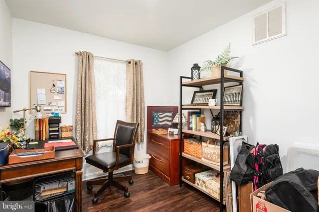a view of a workspace with furniture and toys